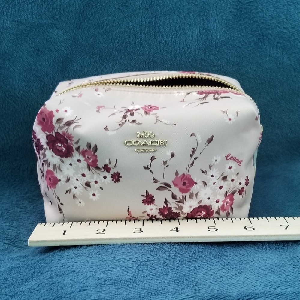 Small Floral Print Coach Cosmetic Case.